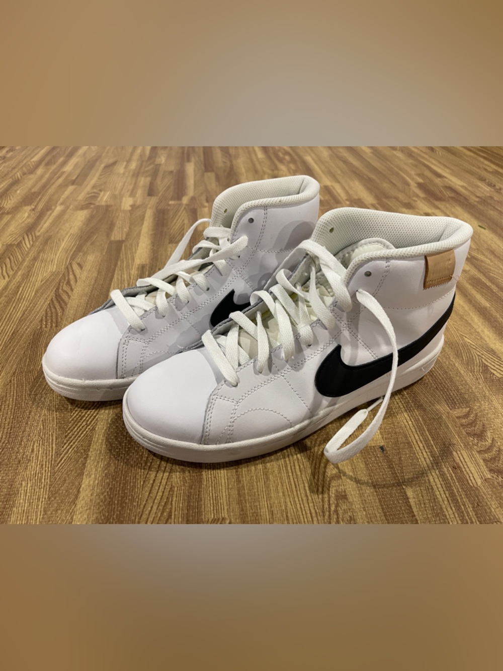 Nike White High-Top Sneakers with Black Swoosh